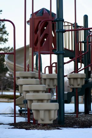 A playground is silently abandoned in the cool, early spring.の写真素材