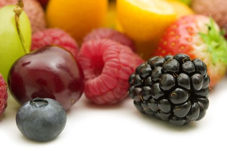 fresh berries and fruits on white backgroundの写真素材