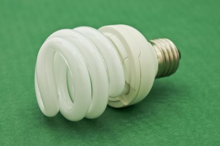 economic light bulb on green backgroundの写真素材