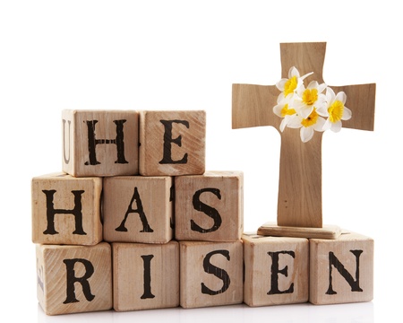 A wooden cross with the words spelled out with rustic alphabet blocks.  Isolated on white.の写真素材