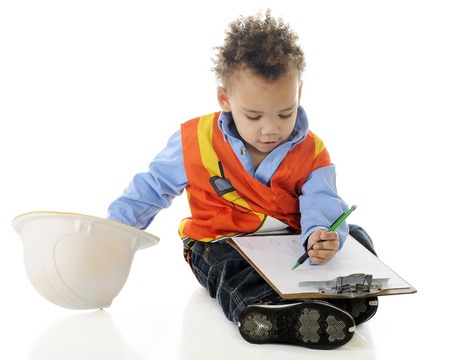 A boy drawing plans on a clipboard   On a white background の写真素材