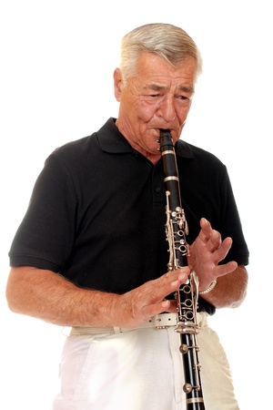 Senior man playing his clarinet の写真素材