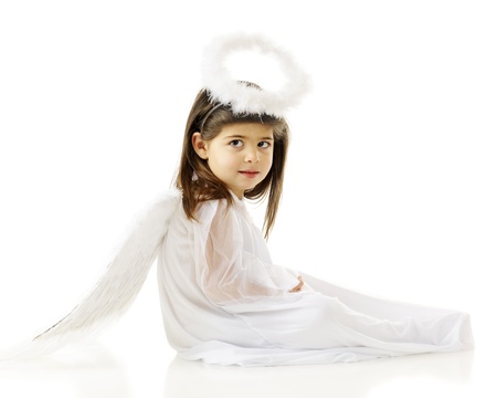 Portrait of a beautiful preschool-aged "angel" with halo, feathered wings and a white gown.  On a white background.の写真素材