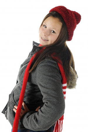 An attractive preteen dressed for warm weather twisting to look at the viewer.  On a white background.の写真素材