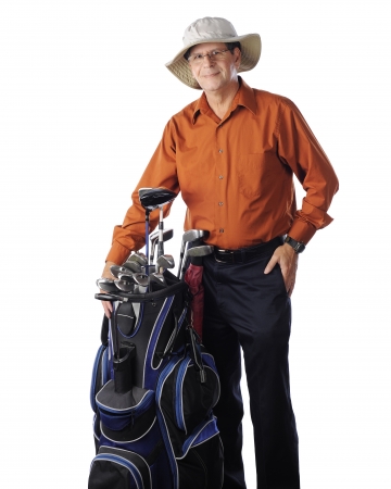 A senior man with his golfing hat and clubs.  On a white background.の写真素材