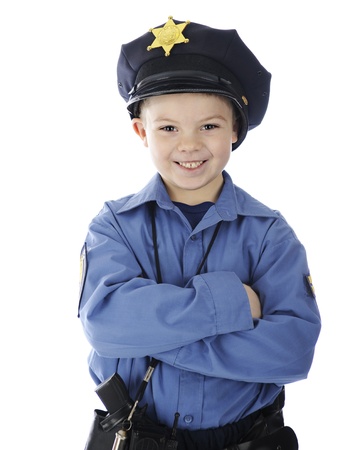 Close-up image of a happy young policeman with his arms folded across his chest   On a white background の写真素材