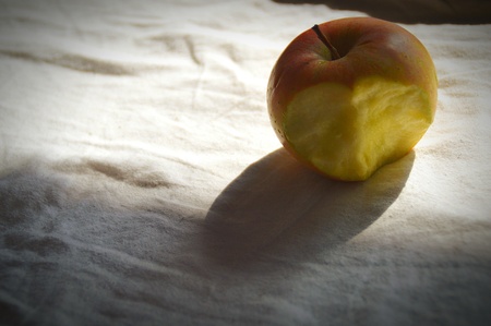Still life of a bitten appleの写真素材