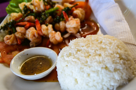 fresh seafood with chili and basil, with rice as an accompanimentの写真素材