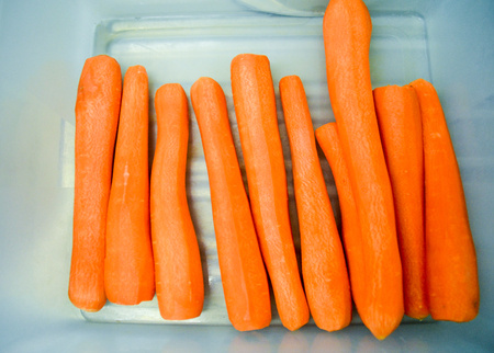 Freshly chopped carrots ready for further processingの写真素材