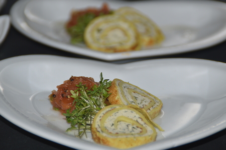A small greeting from the kitchen. Chicken roulade, pumpkin chutney and cressの写真素材