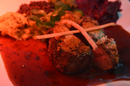 prepared meals under a red glowing lampの写真素材