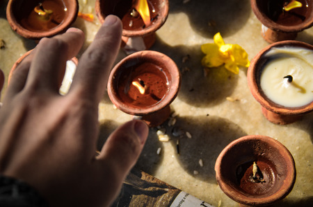 Candles are lit in the temples to believe in the dead and to strengthen their prayers