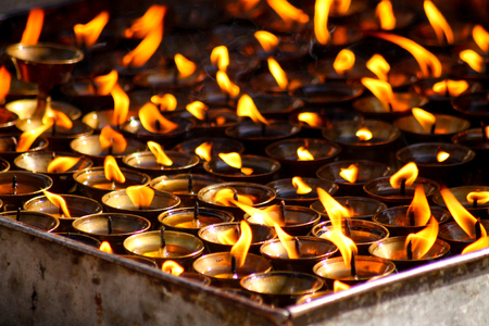 Candles are lit in the temples to believe in the dead and to strengthen their prayersの写真素材