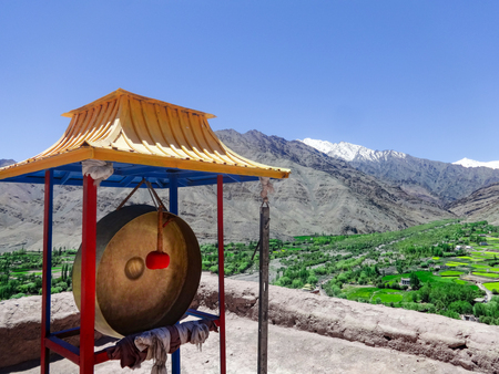 The gong of the monastery in Matho with a view over the Himalaya Mountains, Ladakh, Lehの写真素材