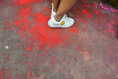 There are colors scattered all over the streets. The remnants of the celebrating crowds, Holi Festival, Pokhara, Nepalの写真素材