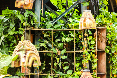 Lamps were enhanced with bamboo scraps to better match their own gardenの写真素材