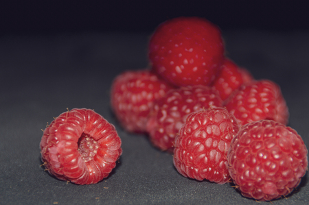 fresh raspberry on black backgroundの写真素材