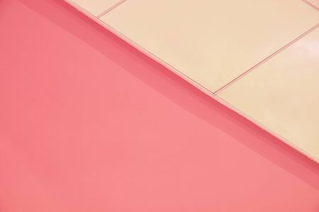 Minimalist pastel pink colored abstract background showing concept of summer and pop cultureの写真素材