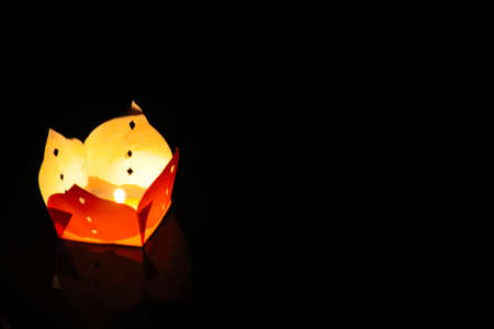 A lone lantern in the night during the Floating Lantern Festival also know as Loy Kratong or YeePeng Festival , celebrated in Thailand, Vietnam, Myanmar, Laos and Malaysiaの写真素材