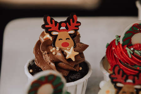 Close up of a cute cupcake in with reindeer decoration to show Christmas themeの写真素材