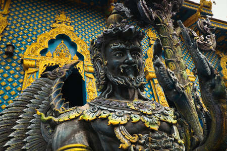 Low angle view of elaborate sculptures at the famous Wat Rong Suea Ten (Blue Temple) in Chiang rai, Thailandの写真素材