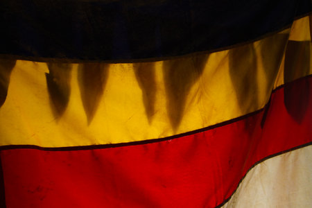 Close up of a Buddhist Flag against light and shadowsの写真素材
