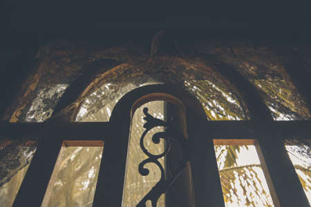 Light coming from a window in a dark and spooky room showing the concept of Halloweenの写真素材