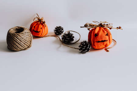 Cute handmade jack-o-lantern decoration for Halloween against white backgroundの写真素材