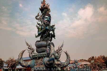 Low angle view of a giant Hindu sculpture in the famous Wat Rong Suea Ten or Blue Temple in Chiang rai Thailandの写真素材
