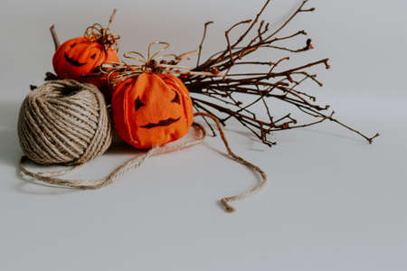 Cute handmade jack-o-lantern decoration for Halloween against white backgroundの写真素材