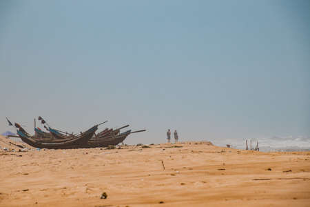 Traditional fishing boats on a sandy beachの写真素材