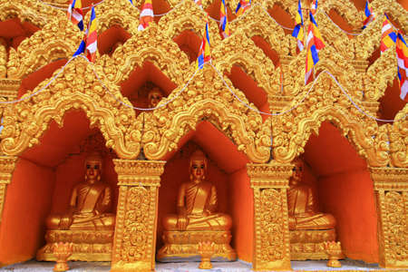 Golden Buddha Statues in Wat Kamchay Mear which is a local public temple in Kampot, Cambodia