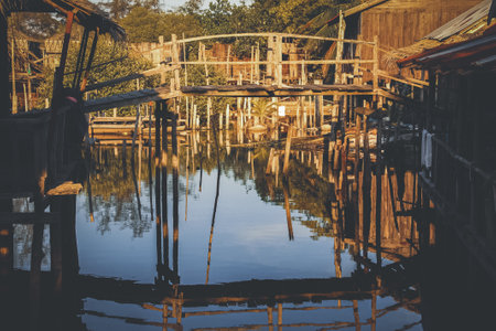 Wooden stilt houses on the water Koh Rong Samloen Island in Cambodiaの写真素材