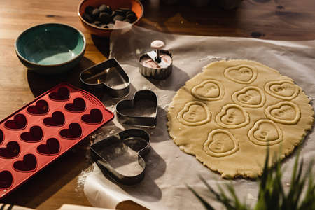 Preparation of heart-shaped cookies for happy birthday. raw dough and heart prints.の写真素材