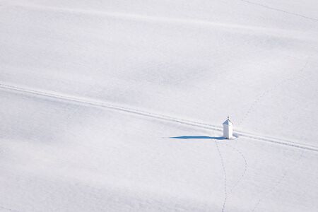 Mountain chapel in mountain landscape in winter under the snow. Schladming-Dachstein, Dachstein massif, Liezen District, Styria, Austriaの写真素材