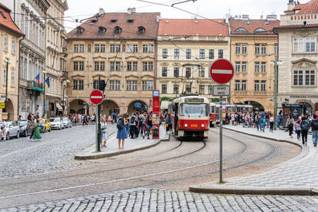 Prague, CZECH REPUBLIC - August 17,2018: Public communication, red tram, walking people in Prague City Center.のeditorial素材