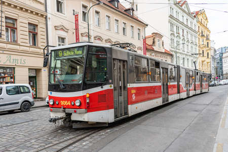 Prague, CZECH REPUBLIC - August 17,2018: Public communication, red tram, walking people in Prague City Center.のeditorial素材