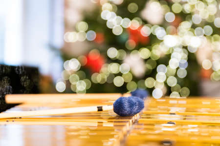 Vibraphone sticks lying on this percussion instrument. In the background, blurry, out-of-focus lights of the Christmas tree.の写真素材
