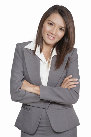 Portrait of a young attractive business woman executive beautiful pretty positive smilling suitの写真素材