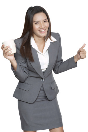 Business woman young pretty attractive beautiful asian model drinking coffee standing happiness relaxation smilingの写真素材
