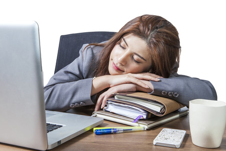Business woman sleeping on laptop taking a power nap during work Isolatedの写真素材