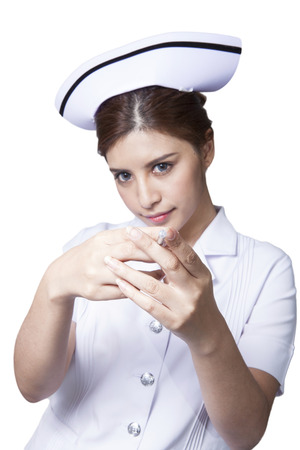 Young woman asian nurse attractive beauty brunette in white backgroundの写真素材