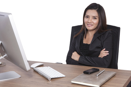 Young business woman attractive with laptop working on table in officeの写真素材