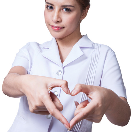 Young woman asian nurse attractive beauty brunette in white backgroundの写真素材