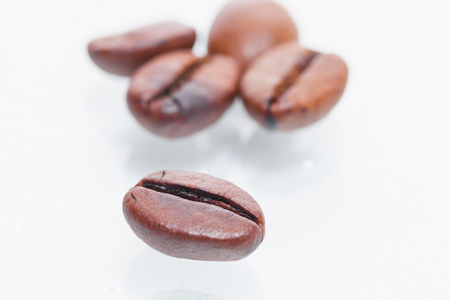 Macro coffee beans isolated on white backgroundの写真素材