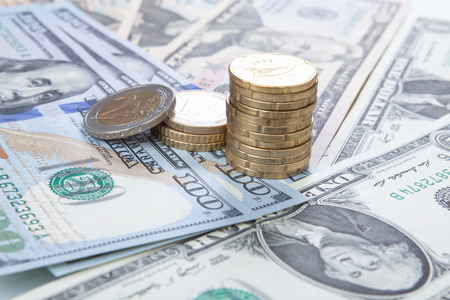 Multiple scattered American 100 dollar banknotes in full frame coverage with corner vignetting...