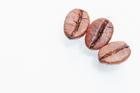 Macro coffee beans isolated on white backgroundの写真素材