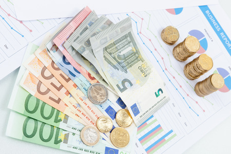 Financial and business chart and graphs, Euro money coin and banknotesの写真素材