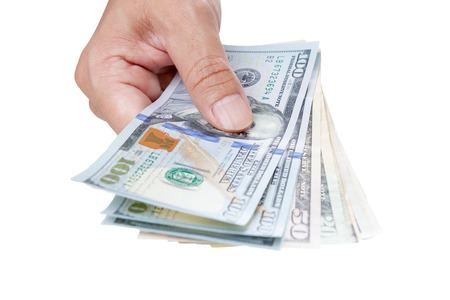 Hand with money isolated on a white background
