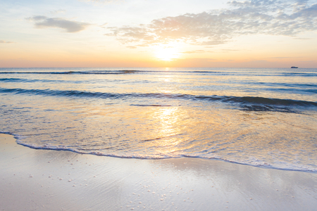 Bright sunrise over the beach an impressive at Hua Hin beach, Thailand.の写真素材